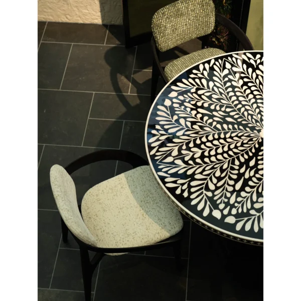 Mother-of-Pearl Inlaid Round Dining Table in black — in a room setting