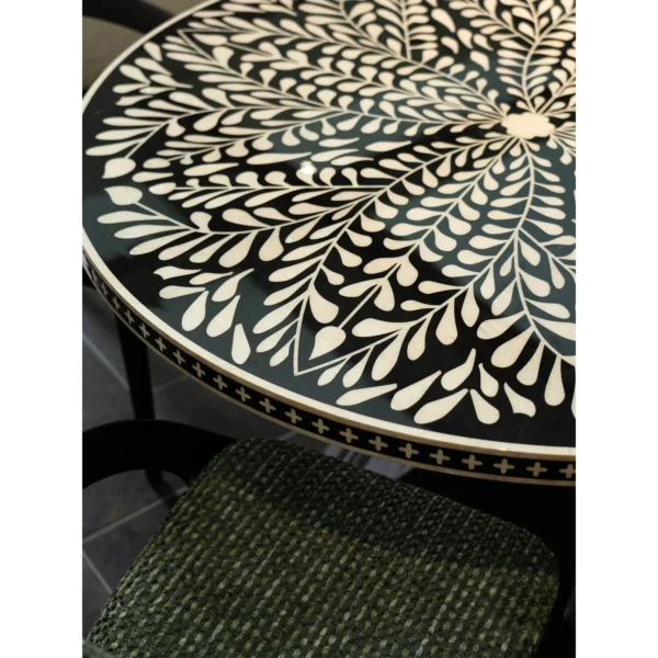 Mother-of-Pearl Inlaid Round Dining Table in black — in a room setting