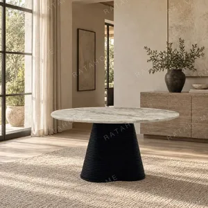 Movement Round Marble Table on Wave-Layered Black Base in ivory — in a room setting