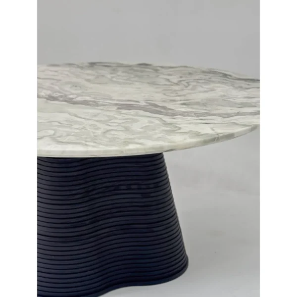 Movement Round Marble Table on Wave-Layered Black Base in ivory — in a room setting