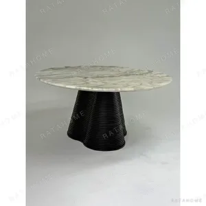 Movement Round Marble Table on Wave-Layered Black Base in ivory — in a room setting