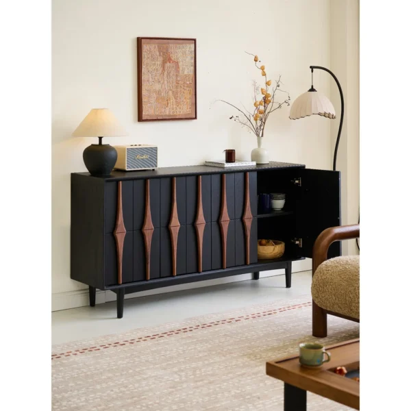 Moying Black Sideboard with Sculpted Walnut Spindle Pulls in black — in a room setting