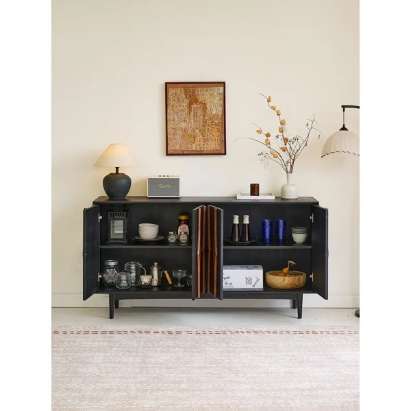 Moying Black Sideboard with Sculpted Walnut Spindle Pulls in black — in a room setting