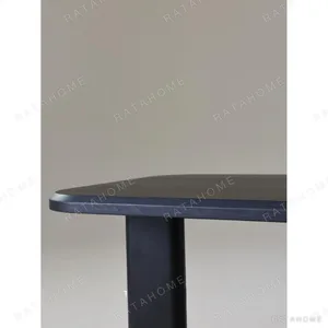 Moyu Black Dining Table with Cane Armchairs in black — in a room setting