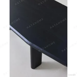 Moyu Black Dining Table with Cane Armchairs in black — in a room setting