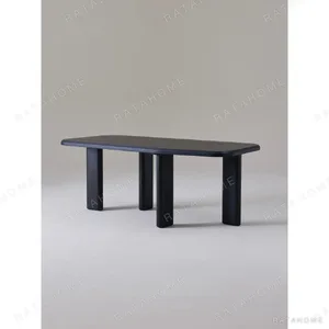 Moyu Black Dining Table with Cane Armchairs in black — in a room setting