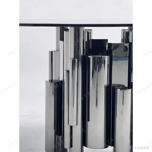 Grey Glass Round Table on Mirror-Steel Column Cluster in slate — in a room setting