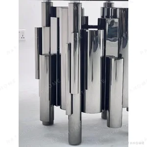 Grey Glass Round Table on Mirror-Steel Column Cluster in slate — in a room setting