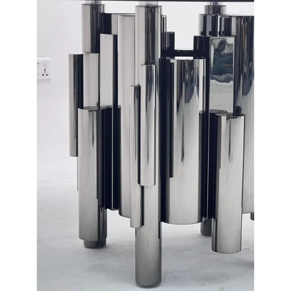 Grey Glass Round Table on Mirror-Steel Column Cluster in slate — in a room setting