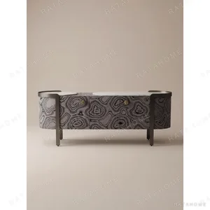 Curved Black Art-Texture Cabinet with Metal Trim and Drawers in black — in a room setting