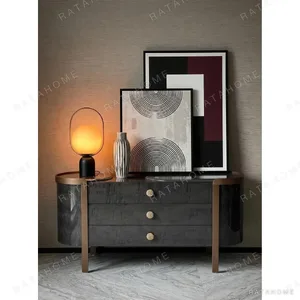 Curved Black Art-Texture Cabinet with Metal Trim and Drawers in black — in a room setting