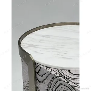 Curved Black Art-Texture Cabinet with Metal Trim and Drawers in black — in a room setting