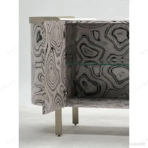 Curved Black Art-Texture Cabinet with Metal Trim and Drawers in black — in a room setting