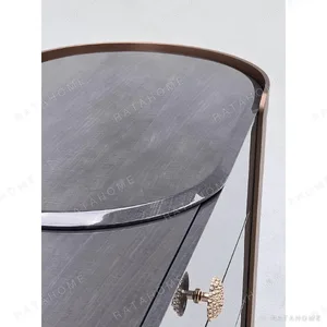 Curved Black Art-Texture Cabinet with Metal Trim and Drawers in black — in a room setting