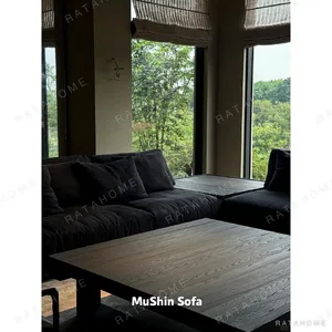 Black Linen Sofa with Loose Cushions in black — in a room setting