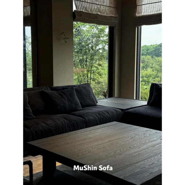 Black Linen Sofa with Loose Cushions in black — in a room setting