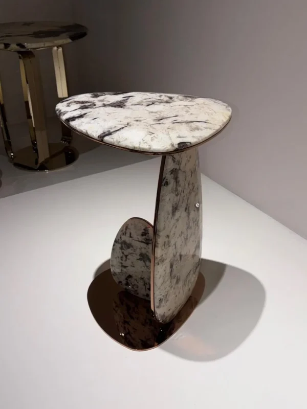 Mushroom Drop Marble Side Table on Rose Gold Steel Base in brushed brass — in a room setting