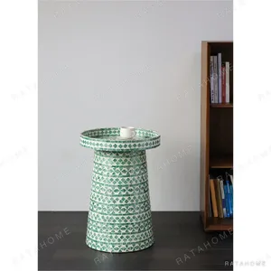 Green Shadow Capiz Shell Tray-Top Pedestal Side Table in olive — in a room setting
