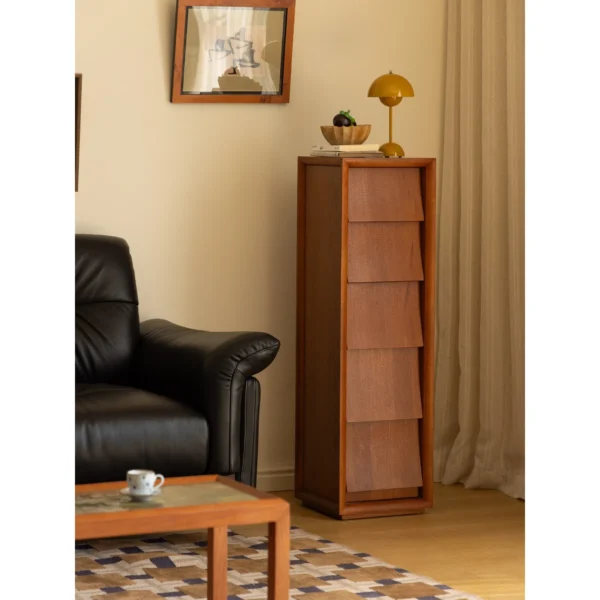 Narrow Teak Corner Cabinet with Eave-Shaped Drawers in clay — in a room setting