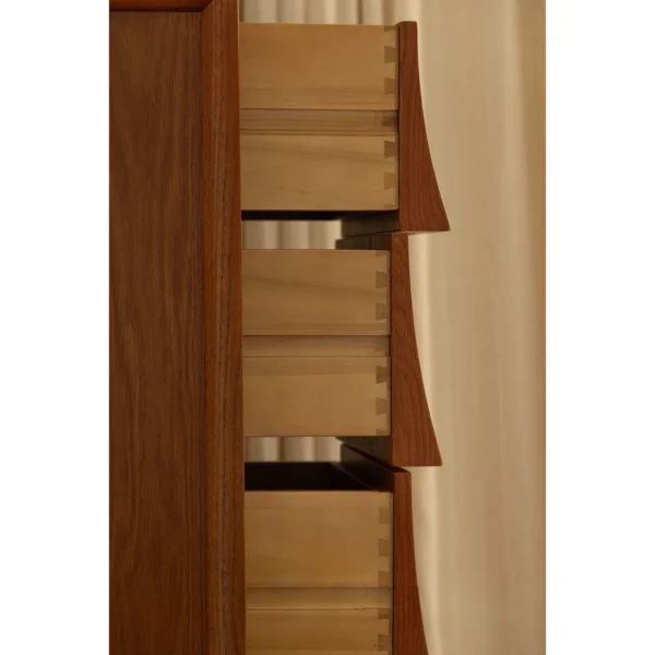 Narrow Teak Corner Cabinet with Eave-Shaped Drawers in clay — in a room setting
