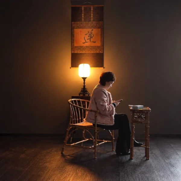 Natural Bamboo Round-Back Armchair in natural oak — in a room setting