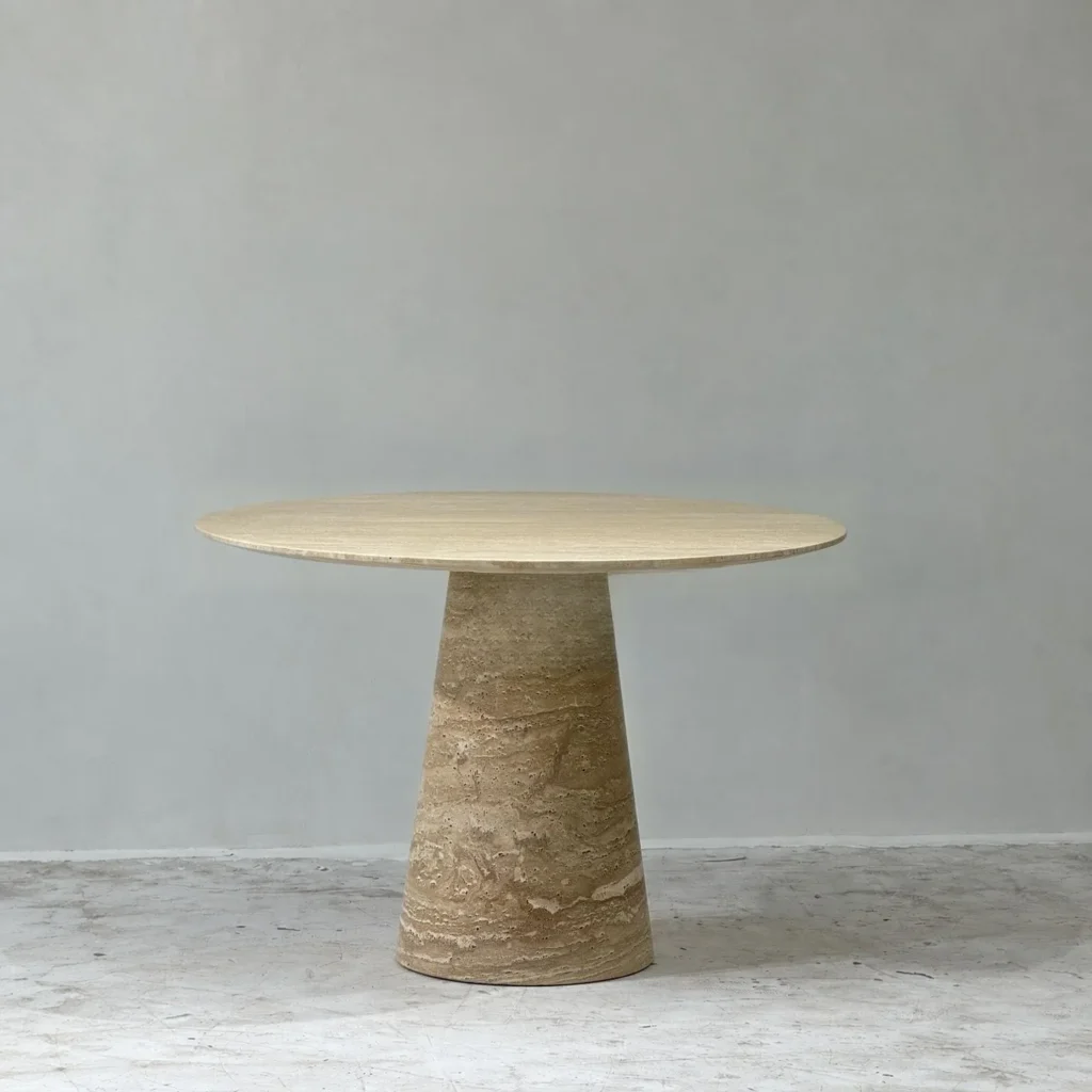 Cream Travertine Round Dining Table on Cone Base in oatmeal — front view