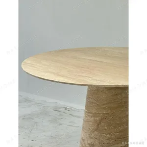 Cream Travertine Round Dining Table on Cone Base in oatmeal — in a room setting