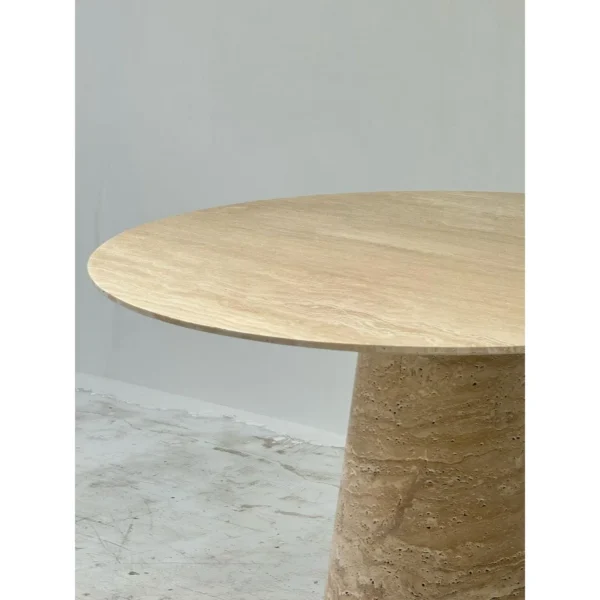 Cream Travertine Round Dining Table on Cone Base in oatmeal — in a room setting