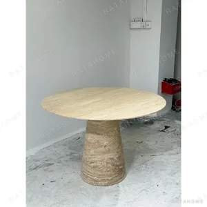 Cream Travertine Round Dining Table on Cone Base in oatmeal — in a room setting
