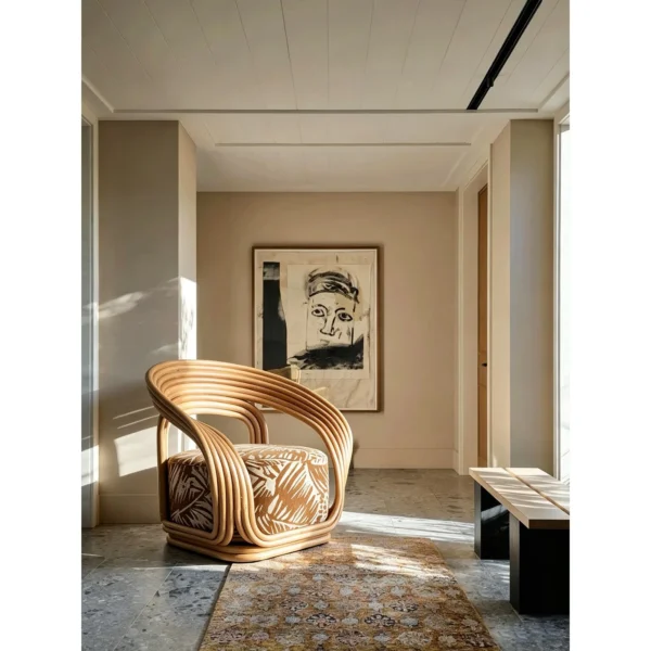 Bentwood Rattan Loop Lounge Chair with Patterned Cushion in natural oak — in a room setting
