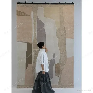 Natural Landform Abstract Patchwork Rug in Sand and Grey — in a room setting