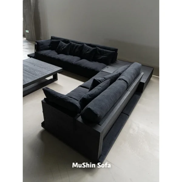 Natural Linen Low-Back Modular Sofa in black — in a room setting
