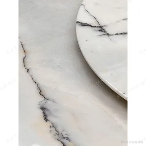 White Stone Round Table in ivory — in a room setting