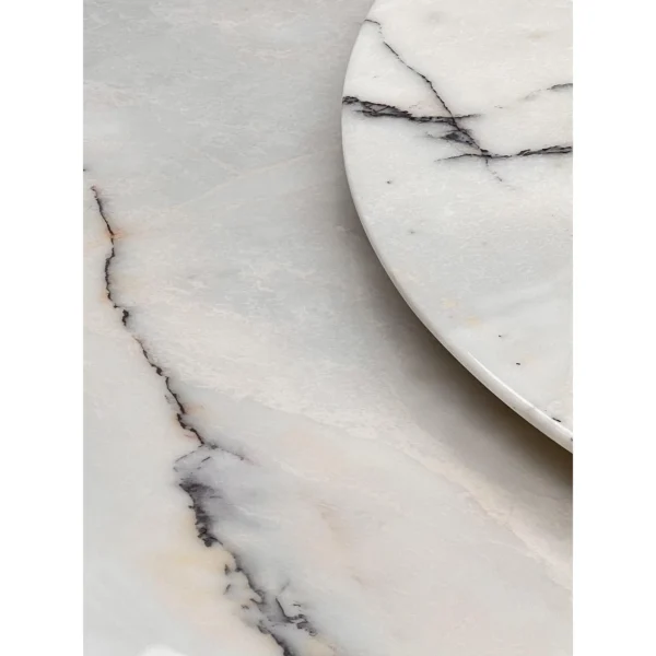 White Stone Round Table in ivory — in a room setting