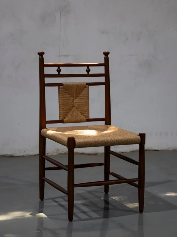 Tall Ladder-Back Dining Chair with Woven Rush Seat in clay — in a room setting