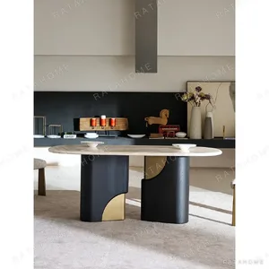Travertine Oval Dining Table on Black Oak Columns with Brass in oatmeal — in a room setting