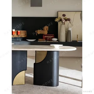Travertine Oval Dining Table on Black Oak Columns with Brass in oatmeal — in a room setting