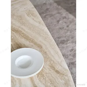 Travertine Oval Dining Table on Black Oak Columns with Brass in oatmeal — in a room setting