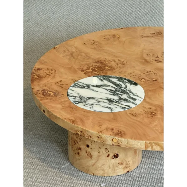Round Burl Veneer Coffee Table in clay — in a room setting