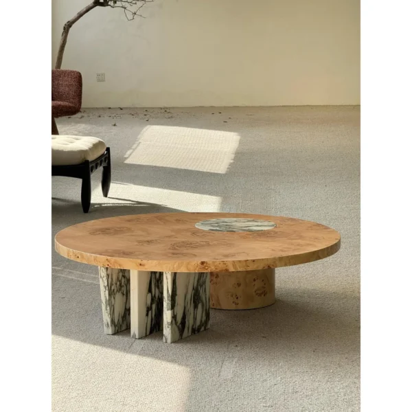 Round Burl Veneer Coffee Table in clay — in a room setting