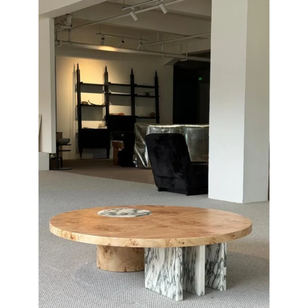 Round Burl Veneer Coffee Table in clay — in a room setting