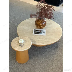 Travertine Round Coffee Table Pair in sand — in a room setting