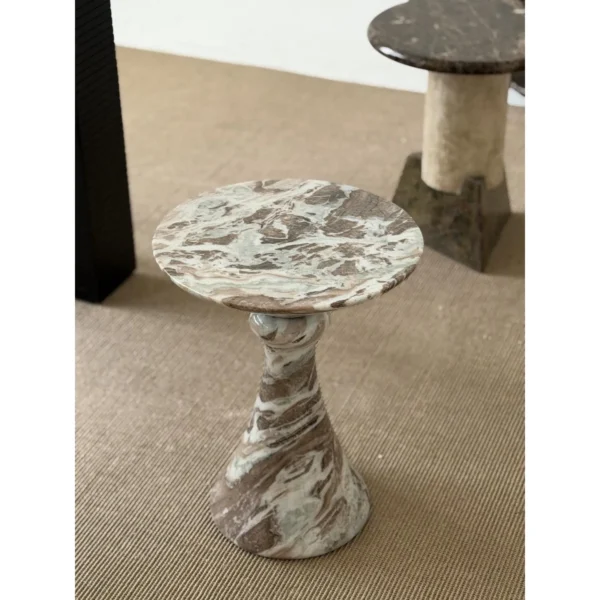 Natural Veined Marble Round Side Table on Sculpted Base in olive — in a room setting