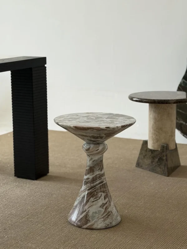 Natural Veined Marble Round Side Table on Sculpted Base in olive — in a room setting