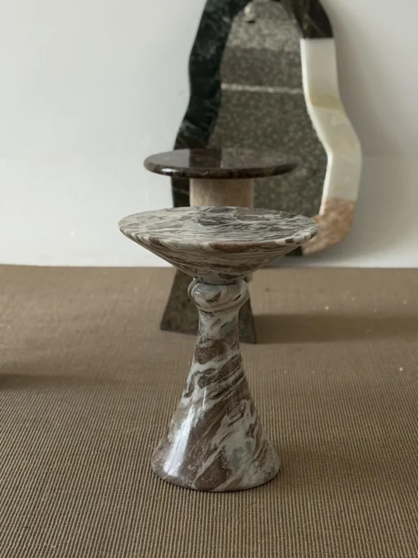 Natural Veined Marble Round Side Table on Sculpted Base in olive — in a room setting