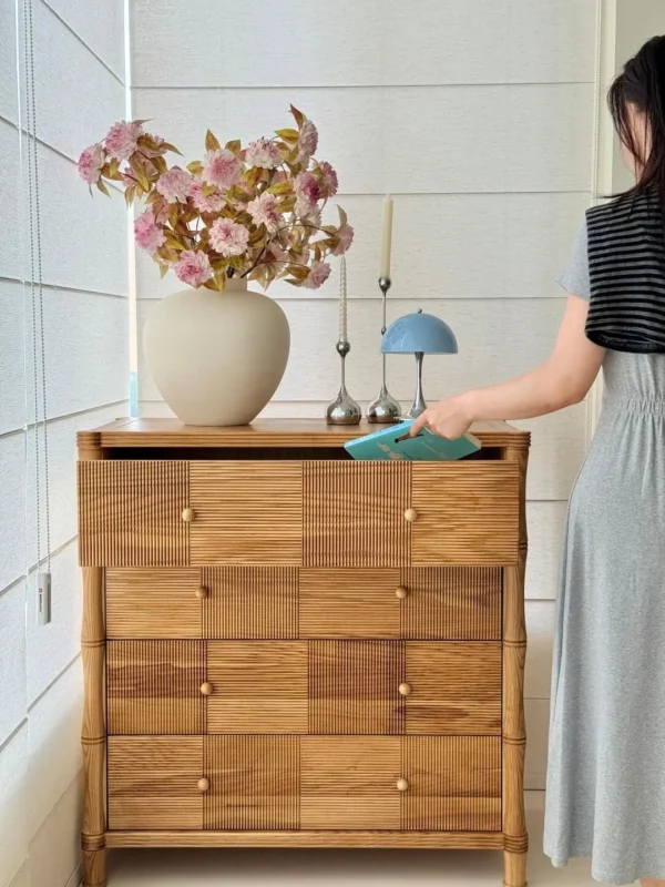 Natural Oak Four-Drawer Chest with Carved Stripes in natural oak — in a room setting