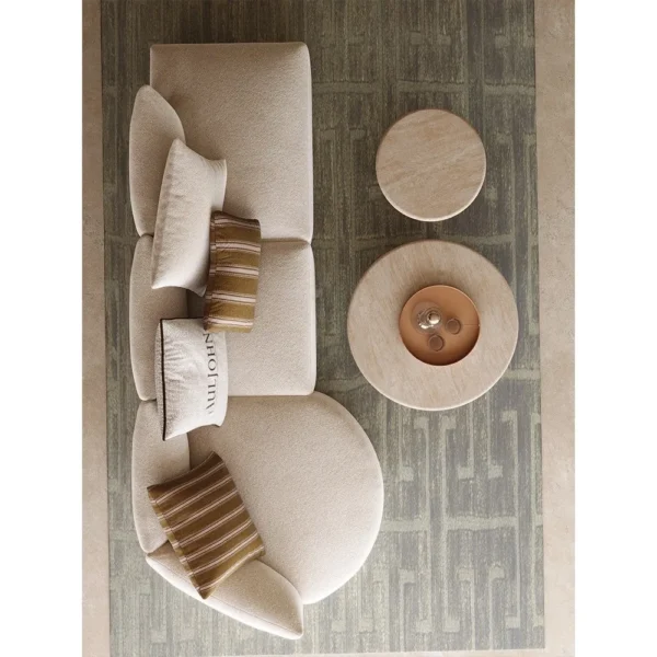 Naturalist Curved Modular Sofa in sand — in a room setting