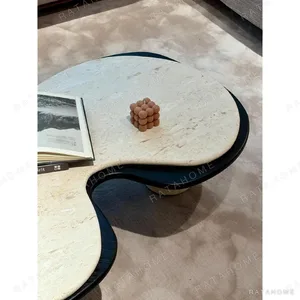 Nebula Travertine Cloud Coffee Table in oatmeal — in a room setting