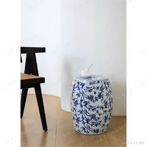 Hexagonal Blue and White Bird and Blossom Ceramic Stool in blue — in a room setting