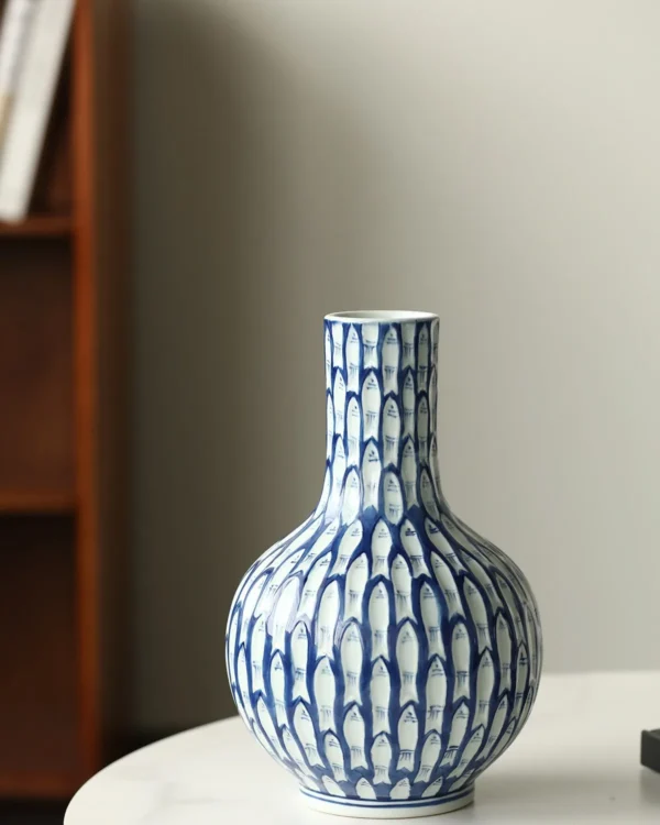 Blue and White Fish-Scale Hand-Painted Ceramic Bottle Vase in blue — in a room setting